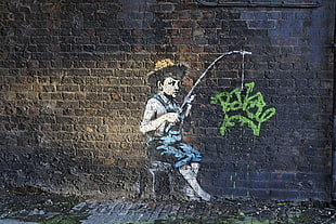 person showing graffiti wall