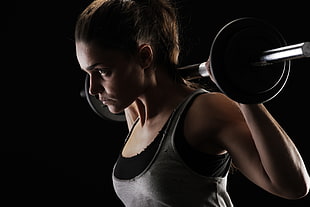 woman carrying barbell on shoulder wearing gray and black tank top HD wallpaper