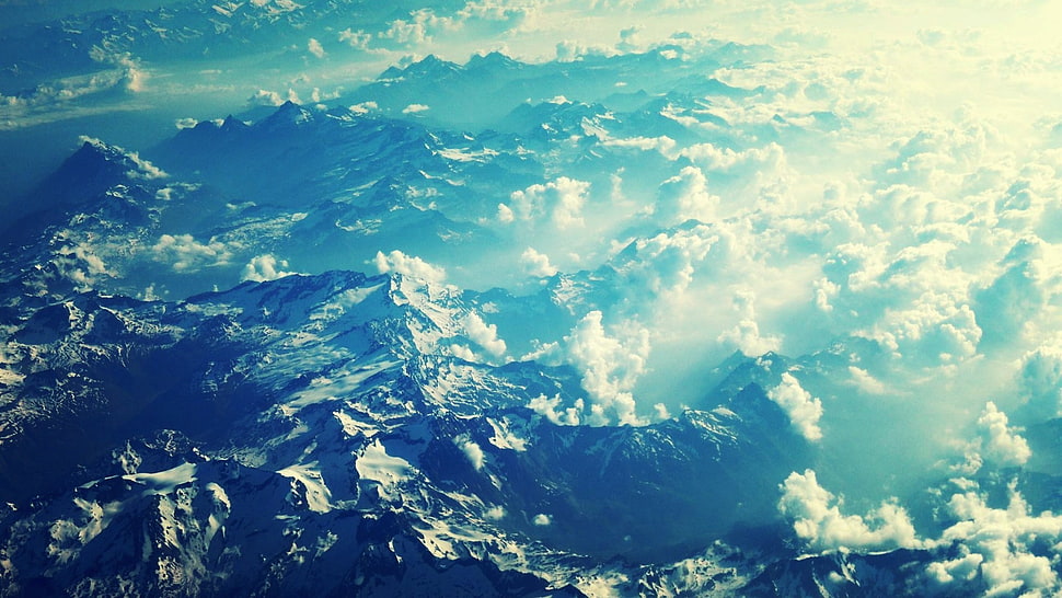 aerial photography of mountain with clouds at daytime HD wallpaper