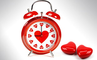 red analog alarm clock