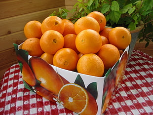 orange fruit lot in square container