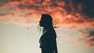 silhouette of woman with golden hour background