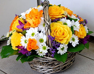 variety of flowers arrangement in basket