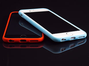 silver iphone 6 with teal case on top of space gray iphone 6 with red case HD wallpaper