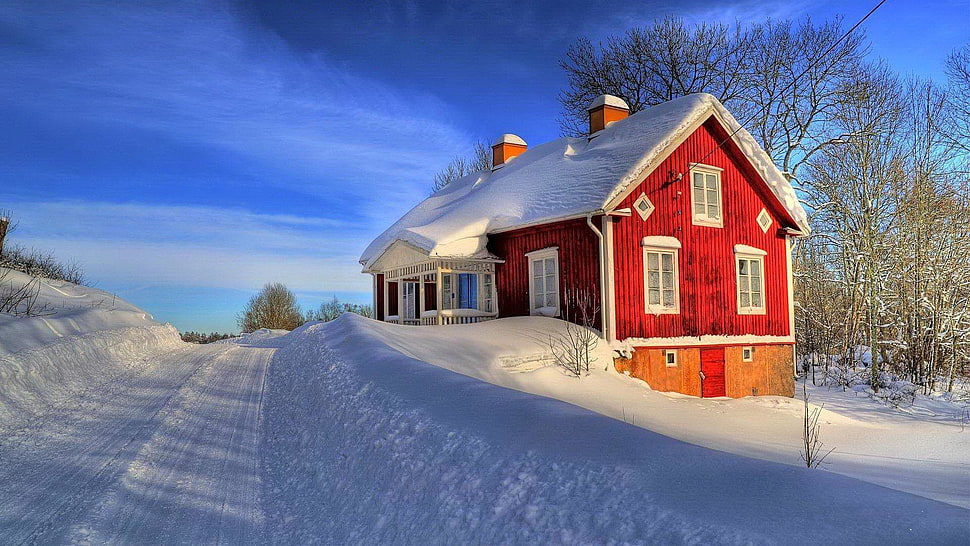 structural shot of red house on white snow field HD wallpaper
