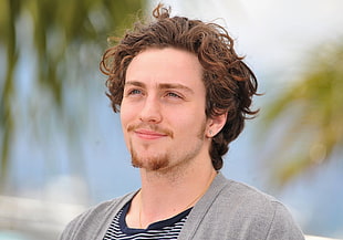 brown curled haired man