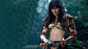 movie character female with gold and red armor outfit HD wallpaper