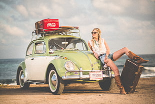 green and white Volkswagen Beetle