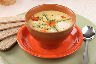 white soup on orange ceramic bowl