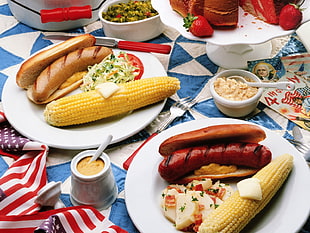 dish with hotdog and corn on a cob