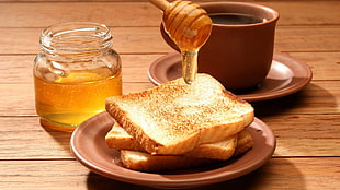 toasted bread with honey jar and cup of coffee with saucer HD wallpaper