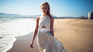 woman in white dress walking in the beach HD wallpaper