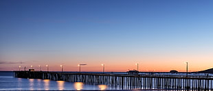 panorama photography of dock during golden hour