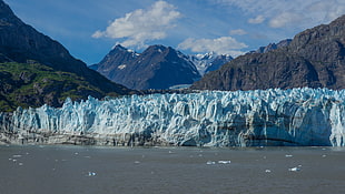 ice formation surrounded by mountains