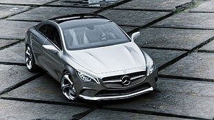 silver Mercedes-Benz sedan parked on concrete ground