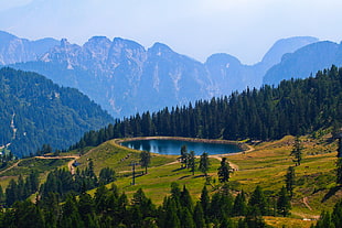 lake on mountain during daytime