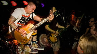 rockband playing on stage inside bar