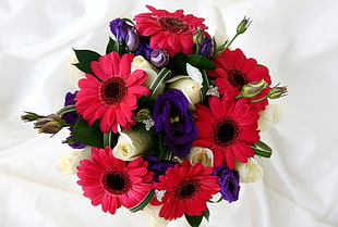 red Gerbera and white Rose flowers centerpiece