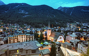 aerial photo of village near mountain