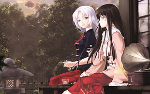 two female anime characters sitting
