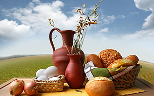 two brown vases beside bread and white eggs