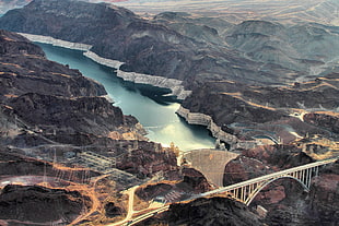 aerial photography of white suspension bridge and mountains, hoover dam