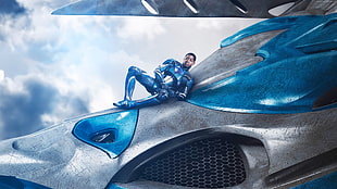 man in blue suit riding spacecraft