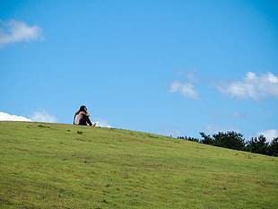 photo of woman in grass field