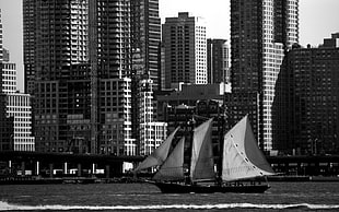 grayscale photo of boat, city