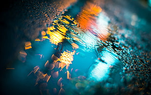 puddle photography of sky lanterns during night