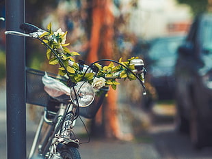 gray commuters bike with flowers decoration