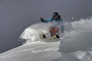 man riding green snow skis doing tricks during daytime HD wallpaper