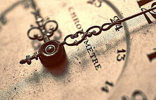 shallow focus photography of gray analog clock
