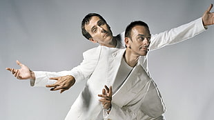 two men wearing white cardigan