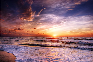 landscape photography of 3 meter ocean waves during sunset