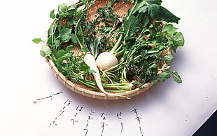 bunch of vegetables on round brown wicker tray