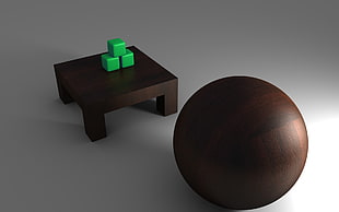 three green cubes on square brown wooden table