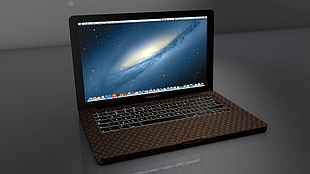 brown MacBook Pro