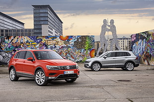 red and gray Volkswagen SUV's