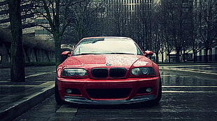 red BMW car on gray concrete road during daytime