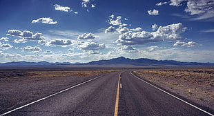 photo of empty road during broad daylight, extraterrestrial highway