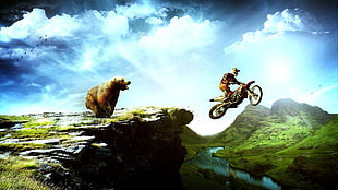 man riding motor crossing cliff