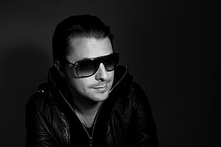 grayscale photography of man wearing sunglasses