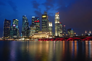 high rise city buildings during night time, singapore city HD wallpaper