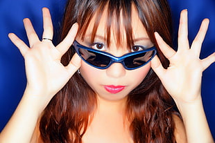 woman wearing blue sunglasses