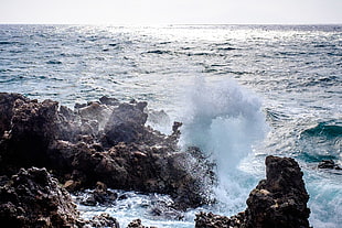 oceam splash in a rocky cliff