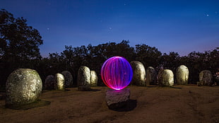 pink and blue LED ball, photo manipulation, light painting, rock