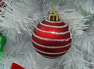 red and gray striped bauble hanging on white Christmas tree