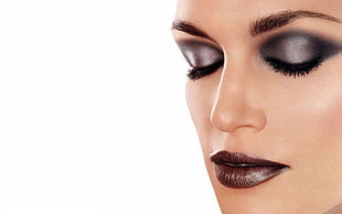 woman with black eyeshadow, black lipsticks, and eyebrow