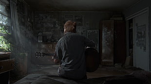 man playing classical guitar inside room